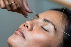 what is eyebrow threading